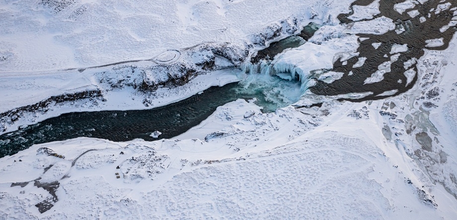Aerial picture of wintery Godafoss waterfall / Copyright: Visit North Iceland